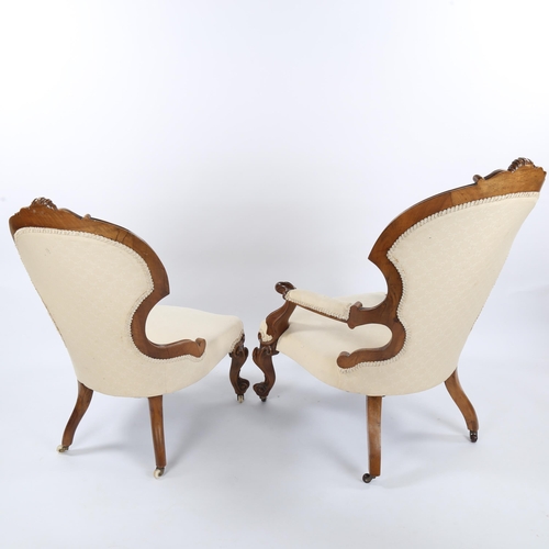 1334 - A pair of Victorian carved walnut-framed fireside armchairs