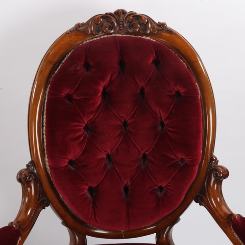 1335 - A pair of Victorian carved walnut-framed fireside chairs