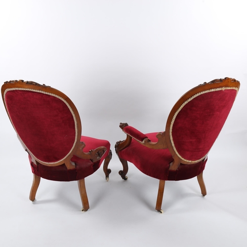 1335 - A pair of Victorian carved walnut-framed fireside chairs