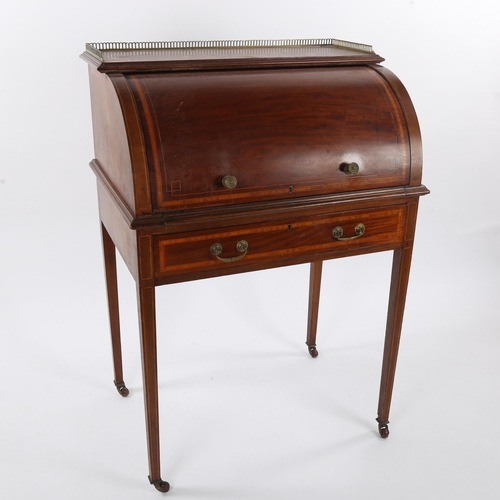 1477 - An Edwardian mahogany and satinwood cylinder-front writing desk, on tapered legs