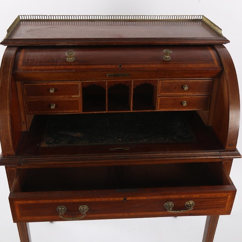 1477 - An Edwardian mahogany and satinwood cylinder-front writing desk, on tapered legs