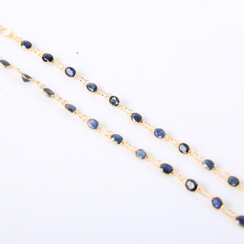 385 - A modern handmade 14ct gold Ceylon sapphire line necklace, set with graduated oval mixed cut sapphir... 