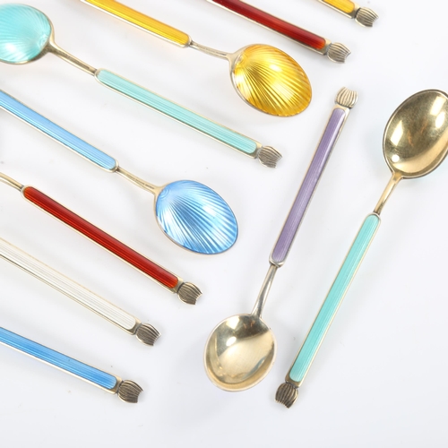 457 - ANTON MICHELSEN - a set of 12 Danish vermeil sterling silver and harlequin enamel coffee spoons, spo... 