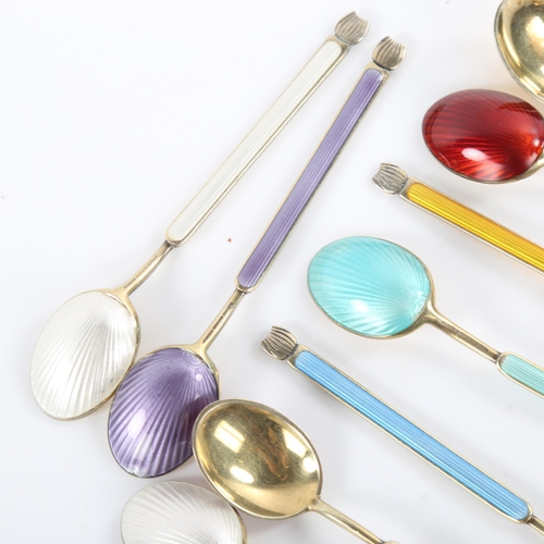 457 - ANTON MICHELSEN - a set of 12 Danish vermeil sterling silver and harlequin enamel coffee spoons, spo... 