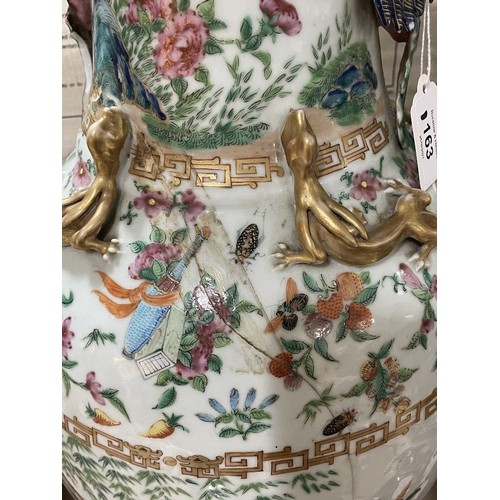 1163 - A pair of Chinese 19th century famille rose porcelain vases, with dragon and bird figures to the nec... 