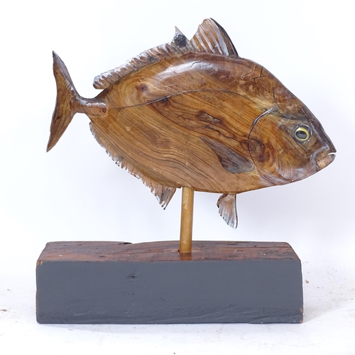 2063 - A stained and painted wood study of a fish on stand, H57cm