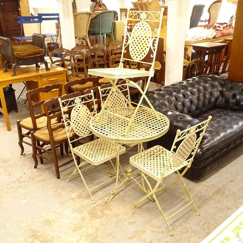 2535 - A white painted metal folding garden circular table, and 4 matching chairs