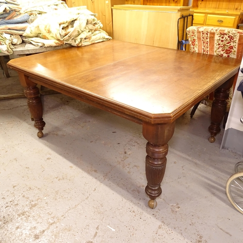 2561 - A late Victorian walnut canted-cornered wind-out dining table, on baluster turned legs, L150cm, H72c... 