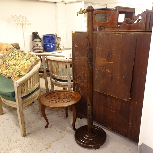 2569 - A Chinese design carved hardwood standard lamp, and a circular lamp table (2)