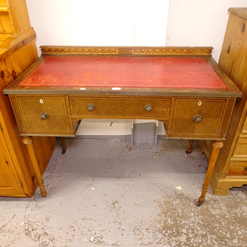 2588 - A mahogany kneehole writing desk, W106cm, H76cm, D53cm