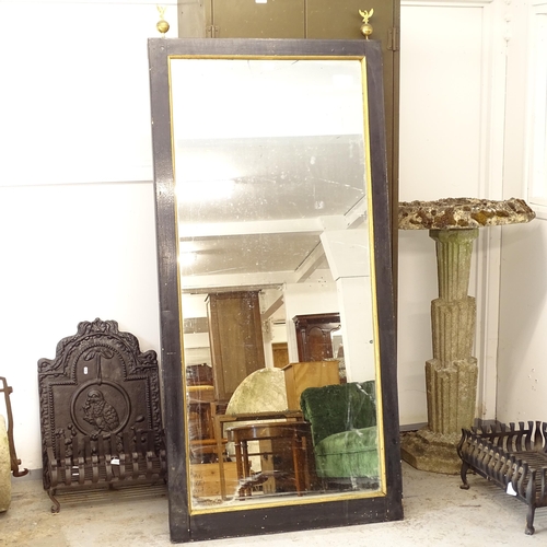 2631 - An ebonised and gilt-framed wall mirror, with brass eagle mounts, W82cm, H175cm