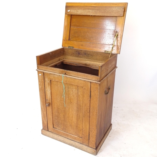 2081 - An oak campaign wash stand, with rising top and cupboard under, W68cm, H92cm, D48cm