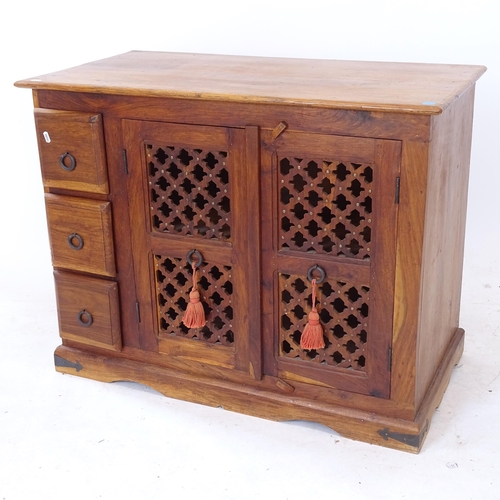 2083 - A hardwood low cabinet, with pierced panelled cupboard doors, W97cm, H75cm, D50cm