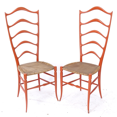 2086 - Chiavari, Italy, a pair of exaggerated high ladder-back chairs in sculptured wood, in the manner of ... 