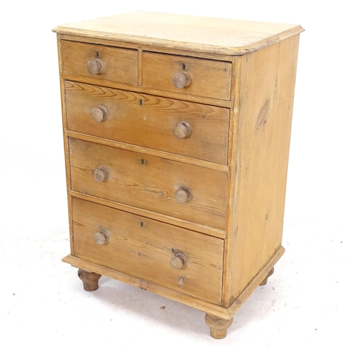 2090 - A narrow pine chest of 2 short and 3 long drawers, on bun feet, W67cm, H95cm, D50cm