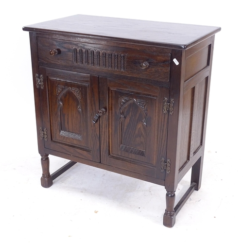 2097 - A small oak side cabinet, with single drawer and carved panelled cupboards under, W75cm, H81cm, D40c... 