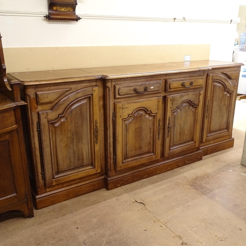 2100 - A large Continental break-front oak dresser base, with 2 frieze drawers, and 4 arch-top fielded pane... 