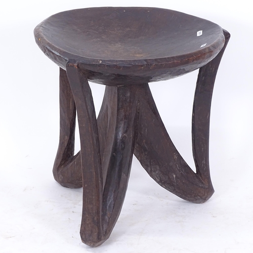 2105 - A carved hardwood Ashanti/Tribal stool, H45cm