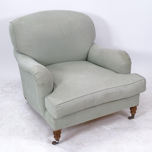 2108 - An upholstered Howard style single armchair, with blue seat cushion