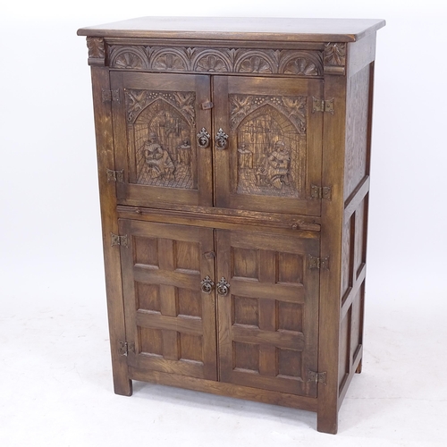 2109 - A carved oak 4-door cocktail cabinet, W84cm, H125cm, D48cm