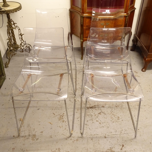 2607 - A set of 4 contemporary design dining chairs, with clear moulded plastic seats, on tubular chromed s... 