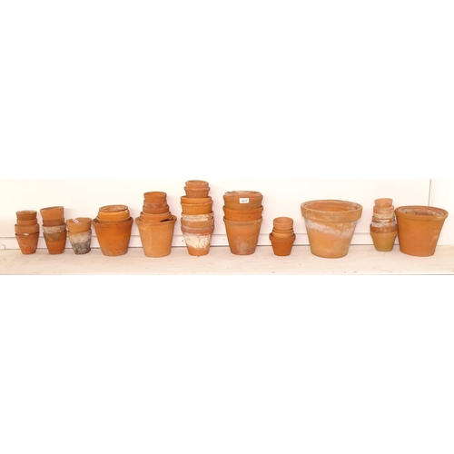 2613 - A collection of terracotta plant pots