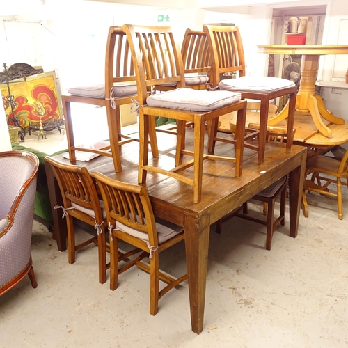 2617 - A large square hardwood dining table, on square tapered legs, together with a set of 8 matching pane... 