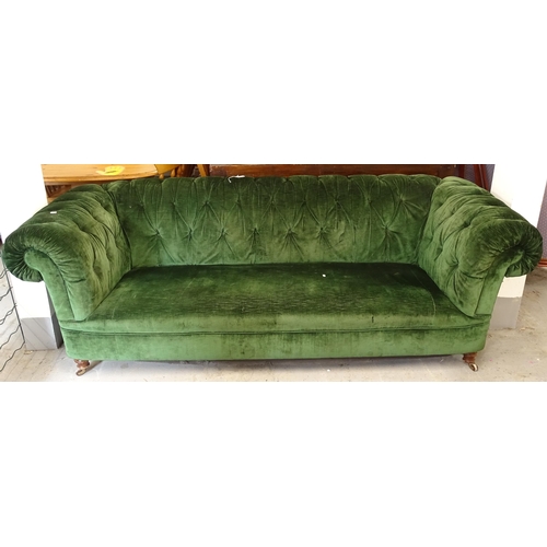 2619 - A button-back green upholstered rollover arm Chesterfield settee, L224cm, H75cm, seat height 37cm an... 