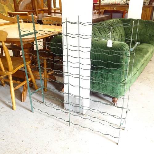 2620 - A green metal folding wine rack, W94cm, H98cm