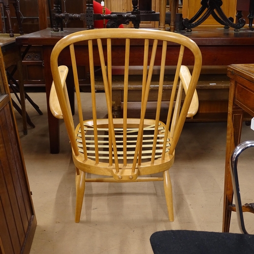 2023 - 2 similar mid-century Ercol armchairs