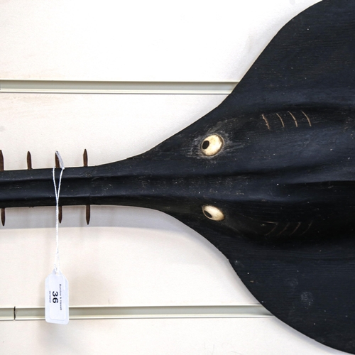 36 - A Vintage black painted hardwood fishmonger's sawfish advertising sculpture, length 140cm