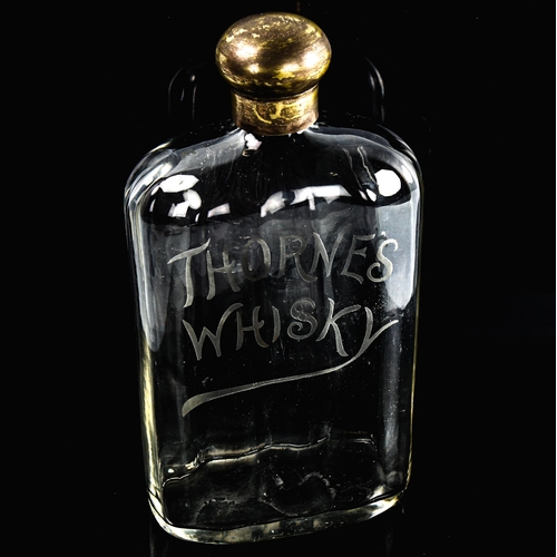 100 - Thorne's Whisky, Antique glass flask with etched advertising logo, plated screw-cap, height 23cm