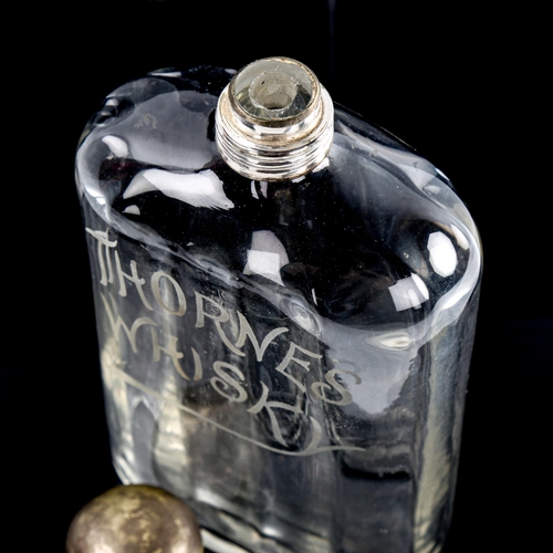 100 - Thorne's Whisky, Antique glass flask with etched advertising logo, plated screw-cap, height 23cm