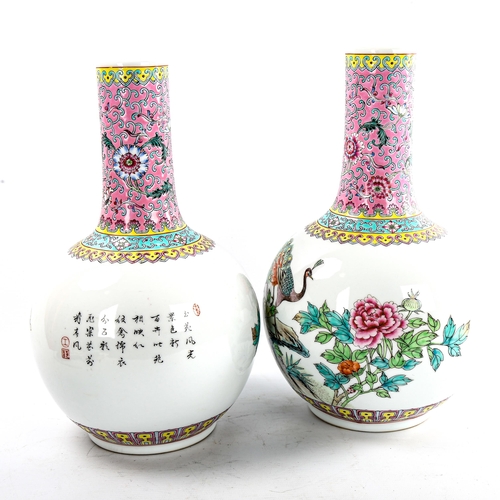 106 - A pair of Chinese porcelain narrow-neck bottle vases, decorated with peacocks and prunus and panels ... 