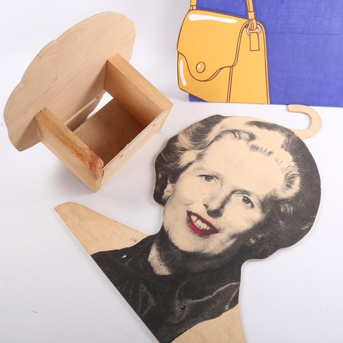 116 - A Margaret Thatcher laminate wood and printed paper wall-mounted lavatory paper dispenser, a charact... 