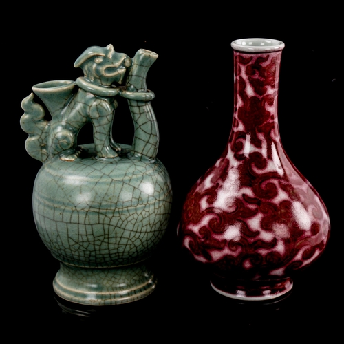 139 - A Chinese red glaze narrow-neck vase with scroll decoration, 6 character mark, height 20cm, and a ce... 