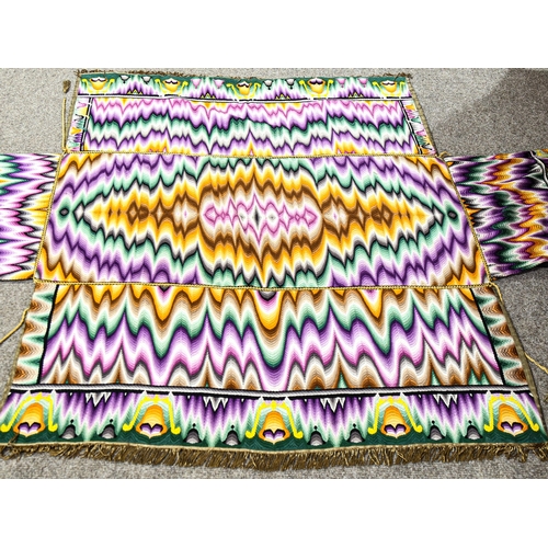 149 - A brightly coloured woven altar cloth, with gold braid surround