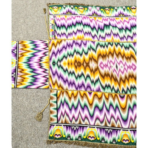 149 - A brightly coloured woven altar cloth, with gold braid surround