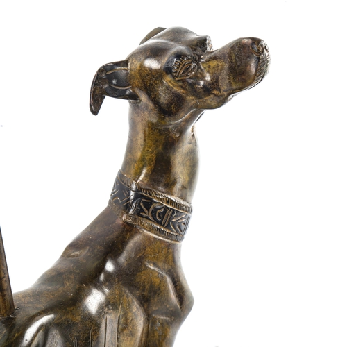 16 - A patinated bronze greyhound design doorstop, on painted iron base, early 20th century, overall heig... 