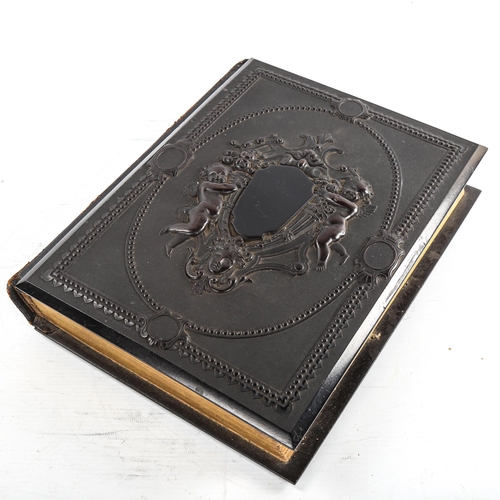 163 - A Victorian album with bois durci covers, containing carte visite, 30cm x 23cm