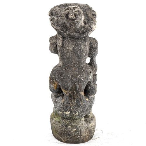 166 - A South American pottery Tribal figure holding a child, height 22cm