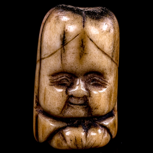 167 - A carved staghorn netsuke of Fukurokuju, height 38mm