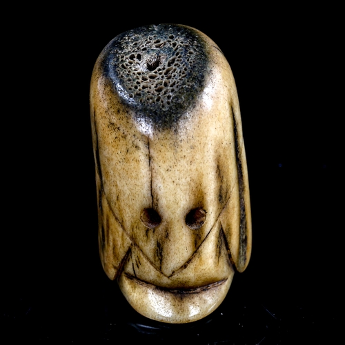 167 - A carved staghorn netsuke of Fukurokuju, height 38mm