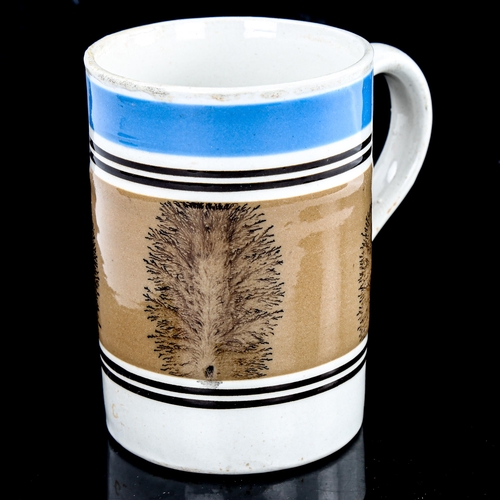 169 - A Victorian Mochaware tankard, height 12.5cm