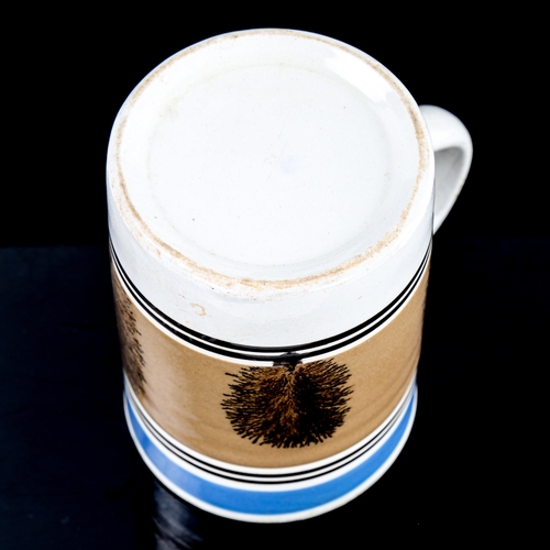 169 - A Victorian Mochaware tankard, height 12.5cm