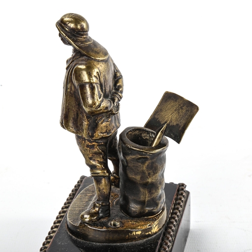 176 - A Victorian cast-brass Vesta stand, in the form of a fisherman, on stained wood base, height 15cm