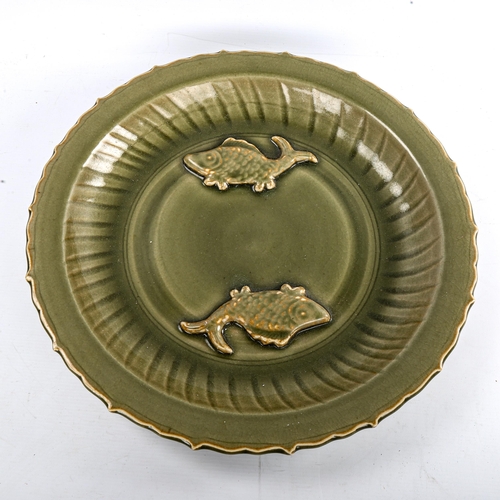 184 - A Chinese celadon glaze porcelain bowl, with relief moulded fish design, diameter 44cm