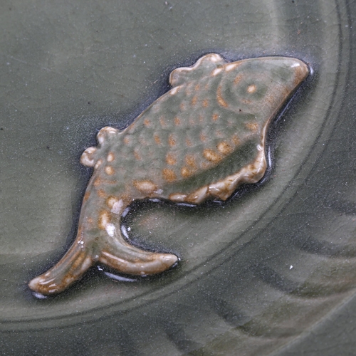 184 - A Chinese celadon glaze porcelain bowl, with relief moulded fish design, diameter 44cm