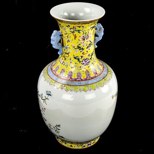 195 - A Chinese white glaze porcelain vase, finely painted enamel flowers with yellow ground neck, seal ma... 