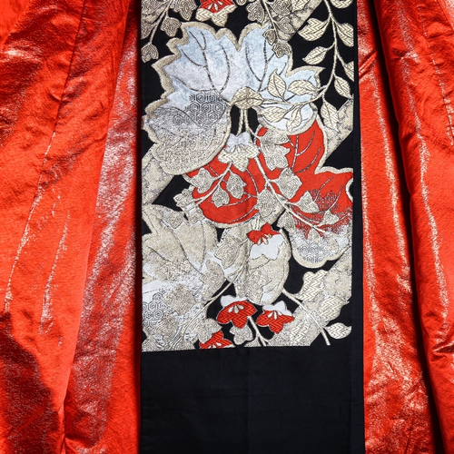 63 - A Japanese wedding kimono, red silk ground with gold and silver embroidered wirework decoration, tog... 